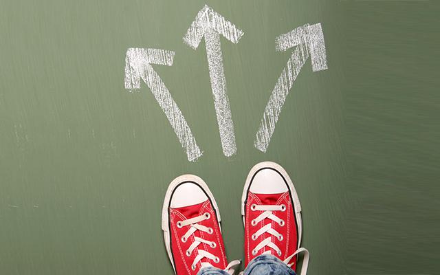 A person standing in front of three arrows showing different waysSome other related images: